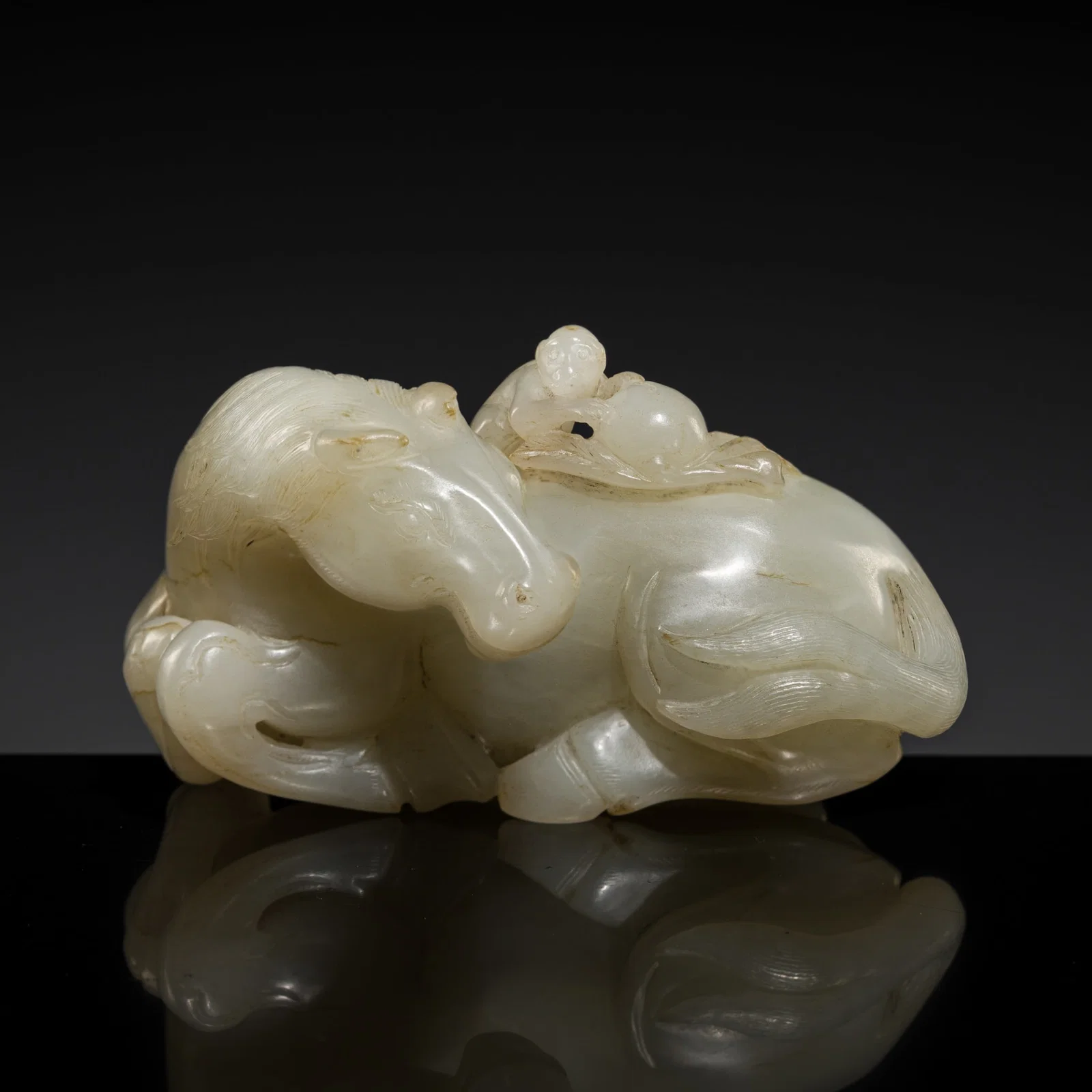 A WHITE JADE 'HORSE AND MONKEY' GROUP, 18TH CENTURY