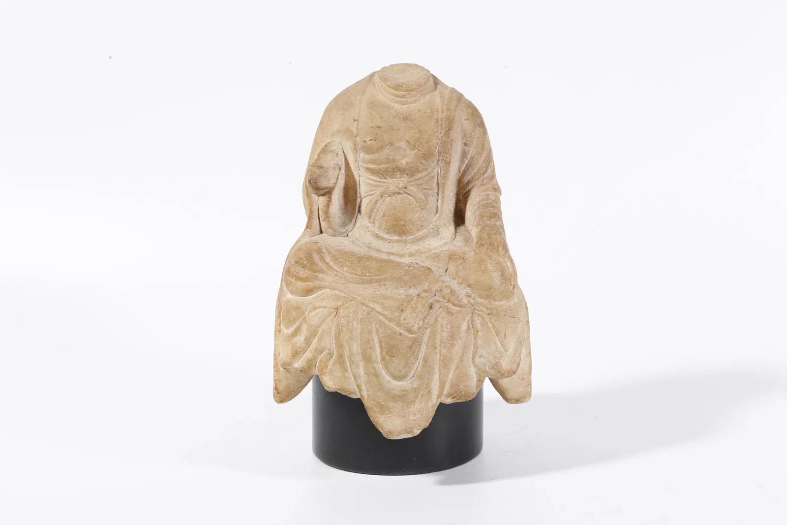 A WHITE MARBLE CARVED BUDDHA FIGURE