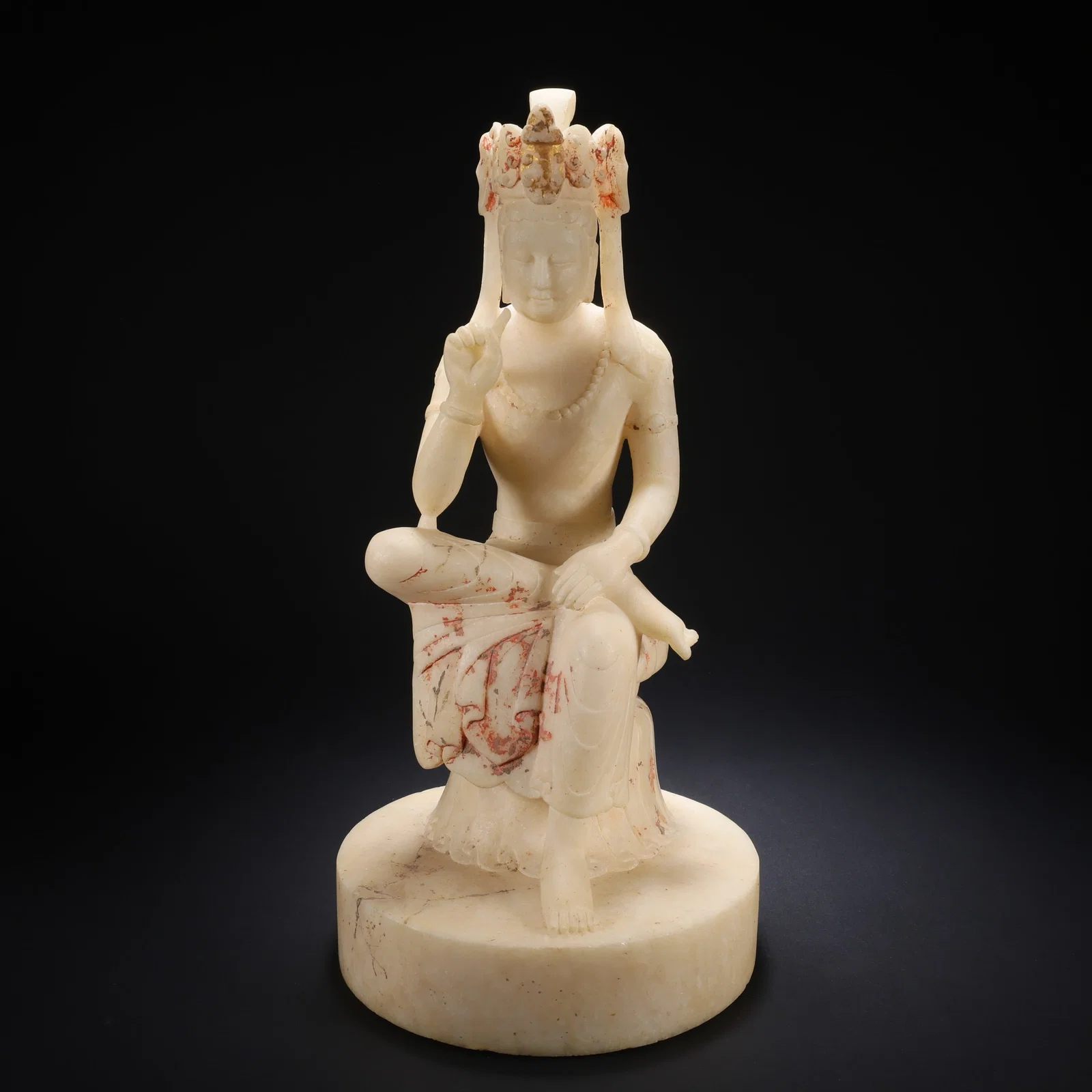 A WHITE MARBLE PAINTED AND GILDED MAITREYA BODHISATTVA