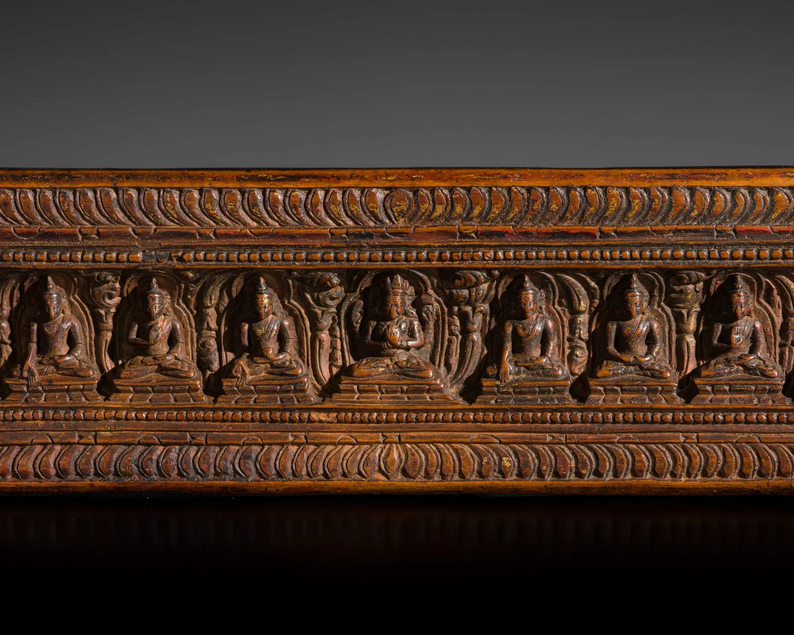 A WOOD MANUSCRIPT COVER WITH PRAJNAPARAMITA AND THE EIGHT DIRECTIONAL BUDDHAS, TIBET, 14TH-15TH