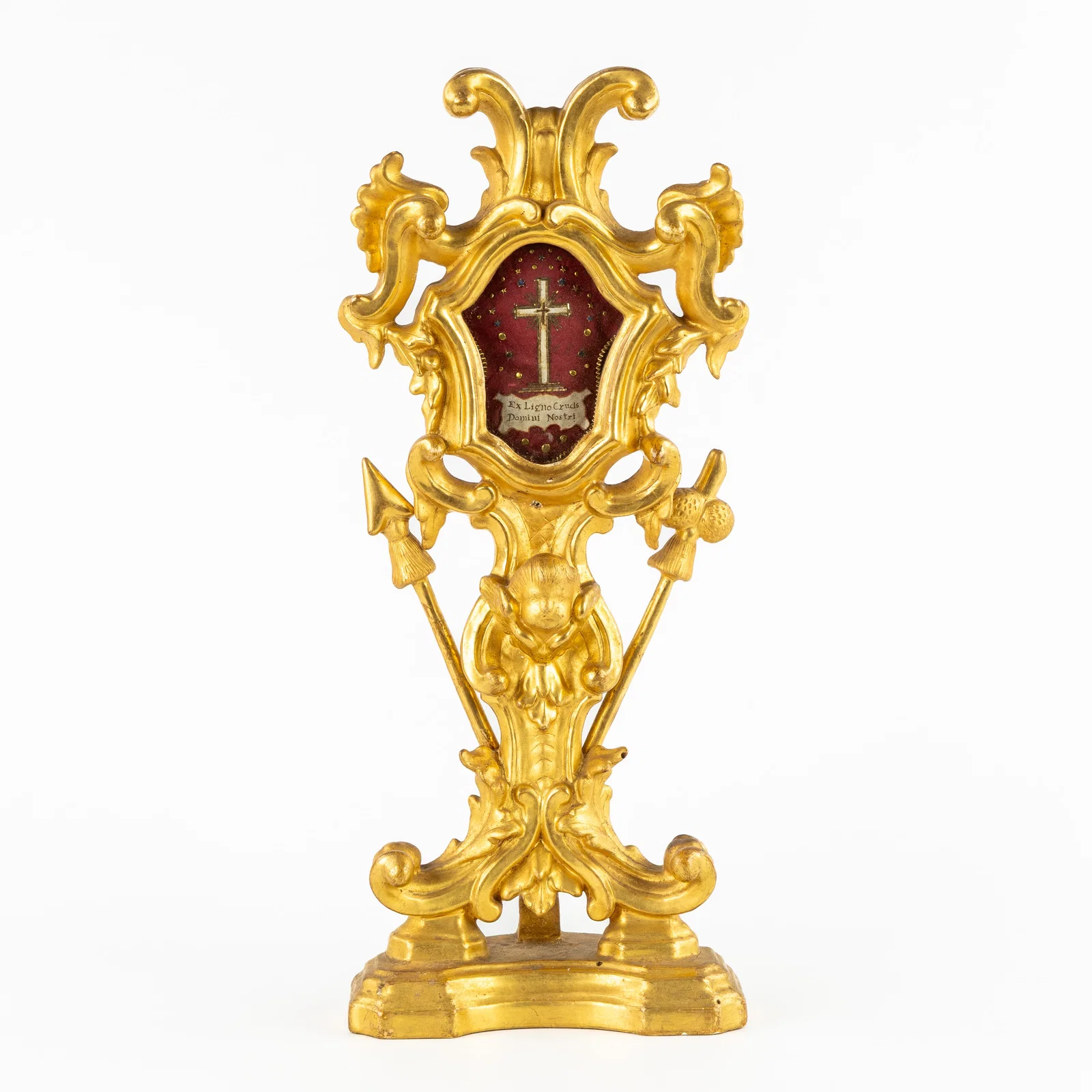 A wood-sculptured and gilt shrine, decorated with the objects of the Passion, Arma Christi, and a
