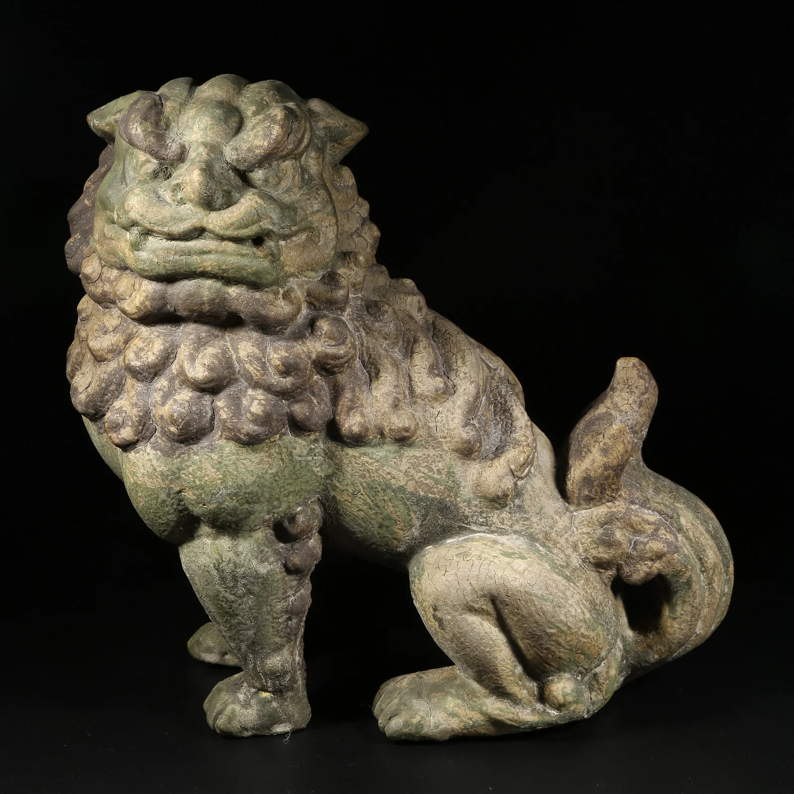 A WOODEN PAINTED SEATED LION