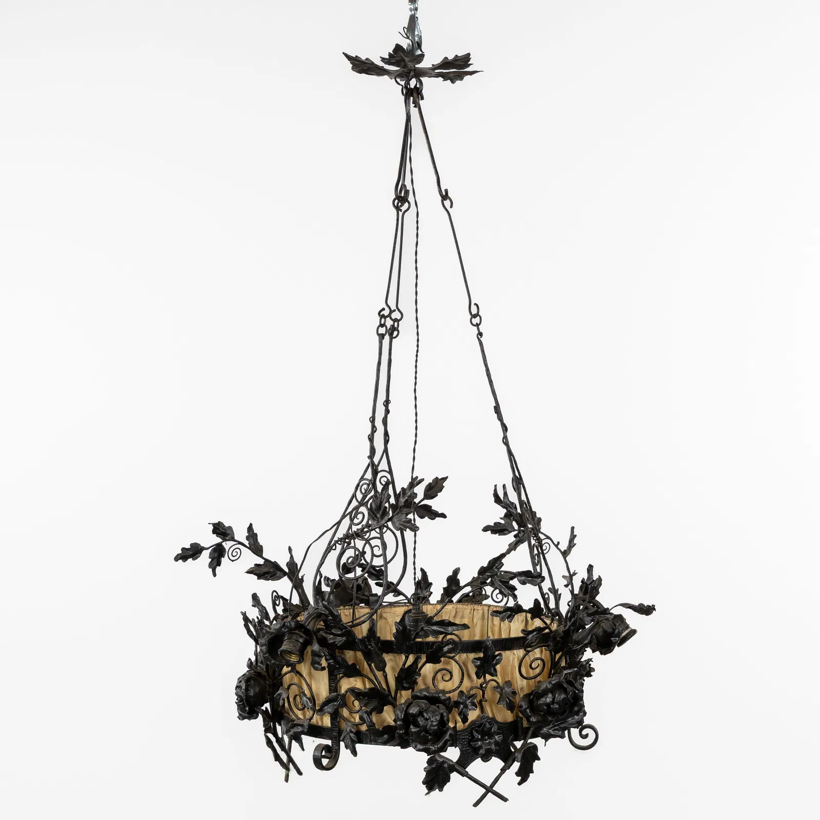 A Wrought iron chandelier, in the style of Louis Van Boeckel.