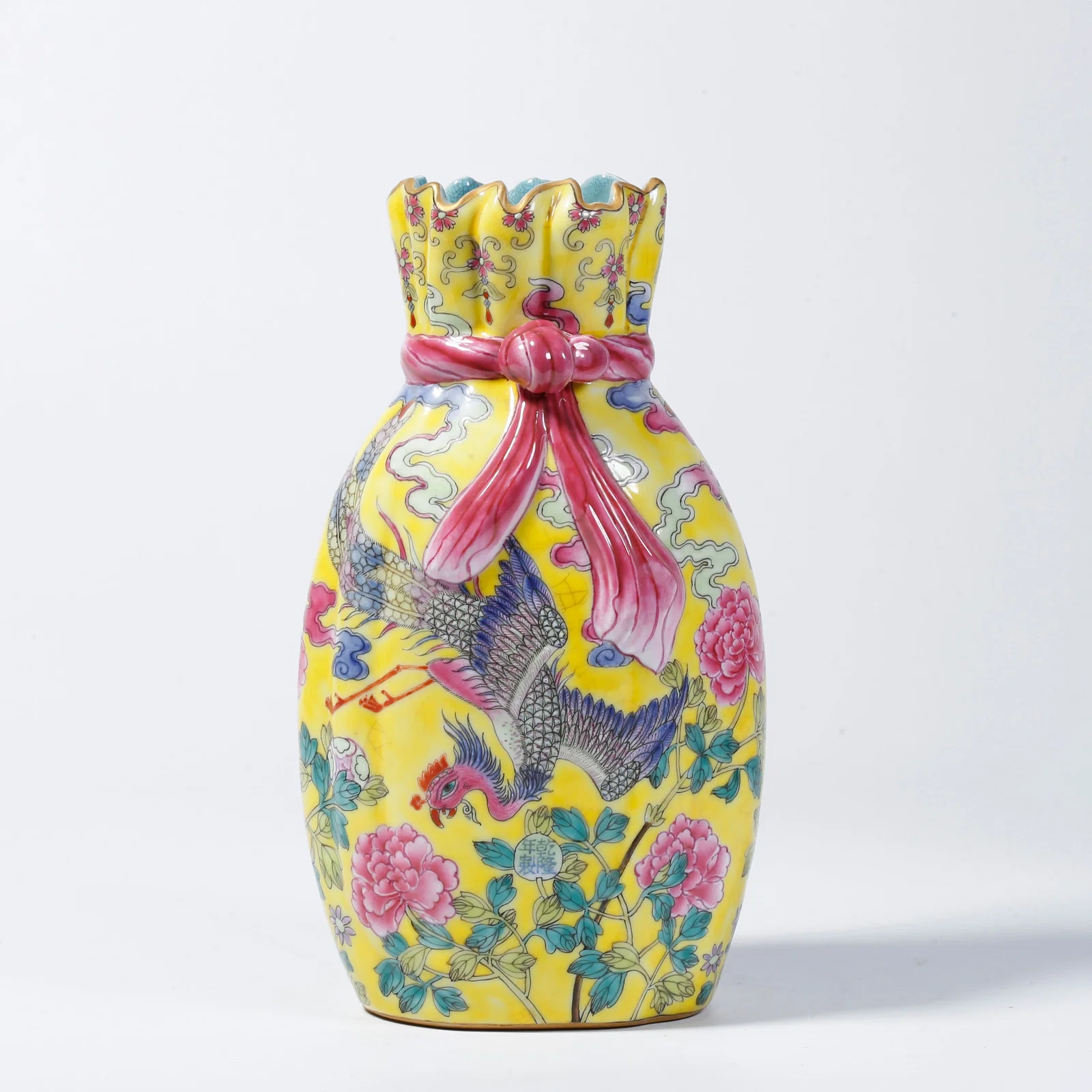 A YELLOW-GLAZED BUNDLE-SHAPED VASE WITH BIRD AND FLOWER DESIGN