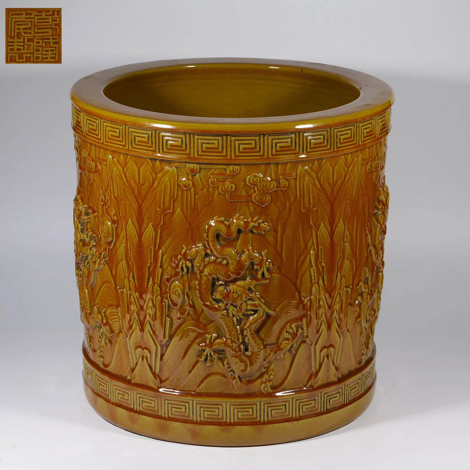 A YELLOW-GLAZED HIGH-RELIEF BRUSH HOLDER WITH JIANGYA SEA-DRAGON MOTIF