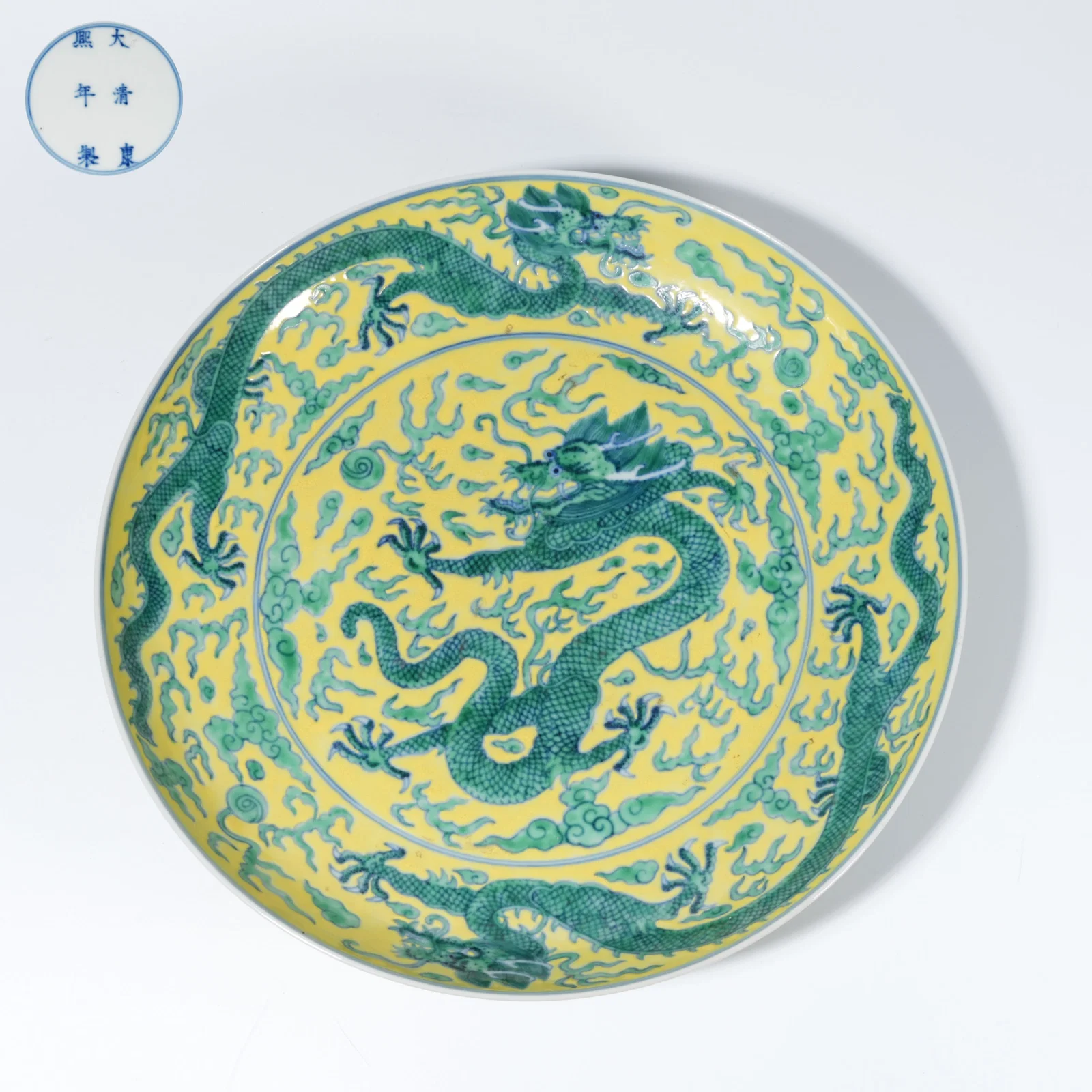 A YELLOW-GROUND GREEN-GLAZED PLATE WITH CLOUD-AND-DRAGON MOTIF