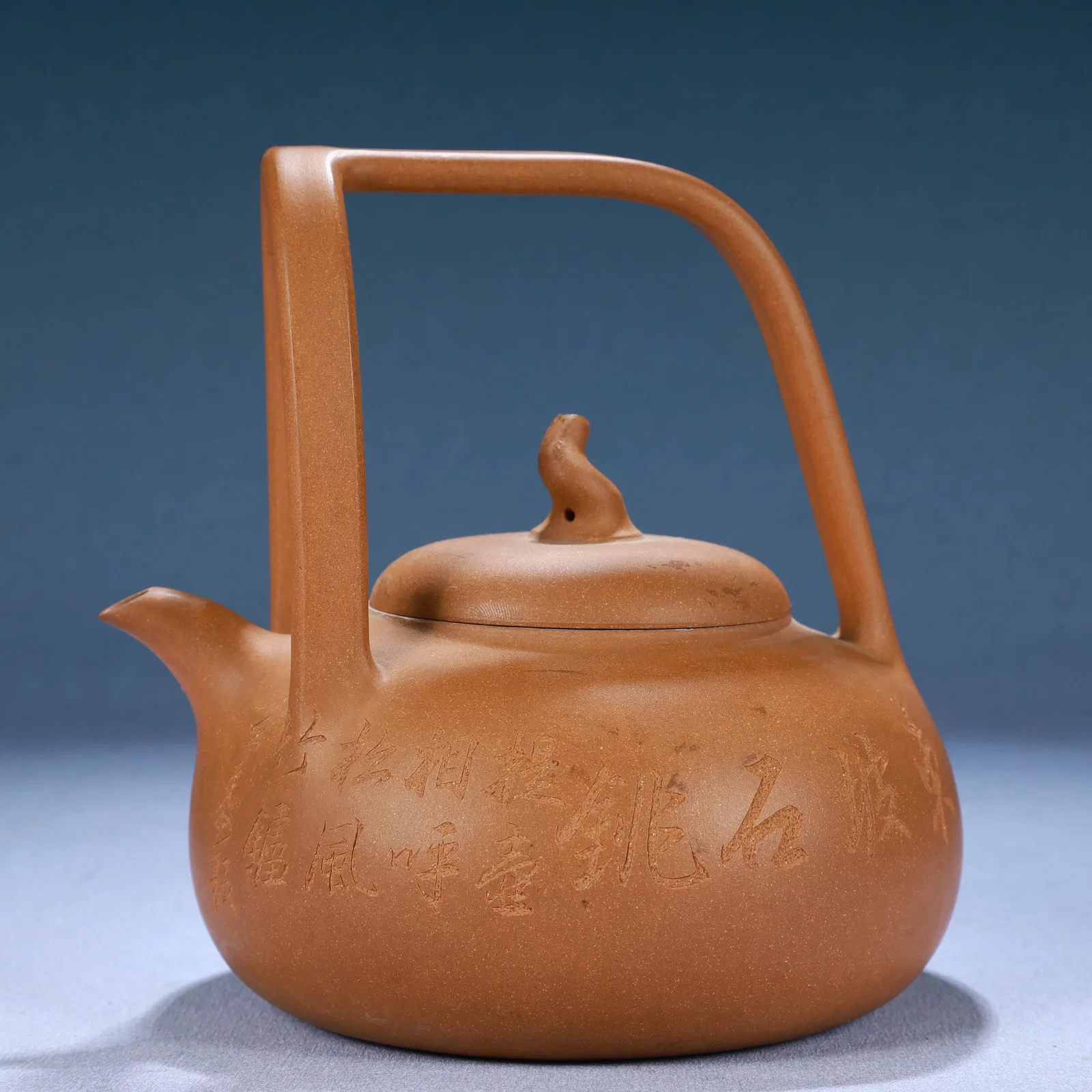 A Yixing Clay Ewer With Poem Inscriptions And An Overhead Handle