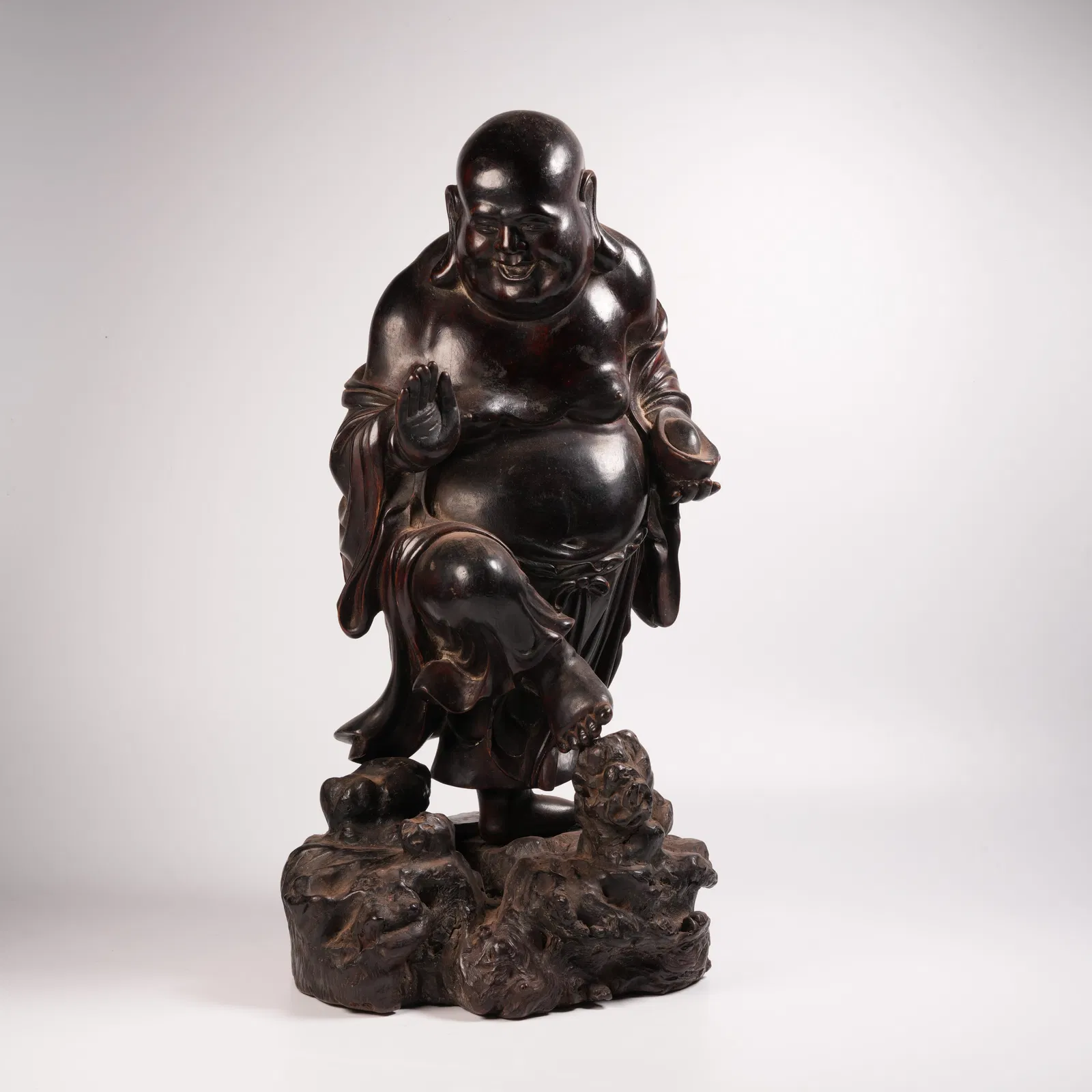 A ZITAN ARHAT FIGURINE BRINGING WEALTH