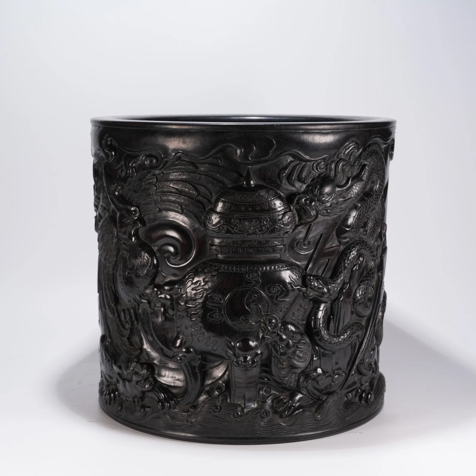 A ZITAN LARGE BRUSH HOLDER WITH DRAGON AND PHOENIX MOTIFS