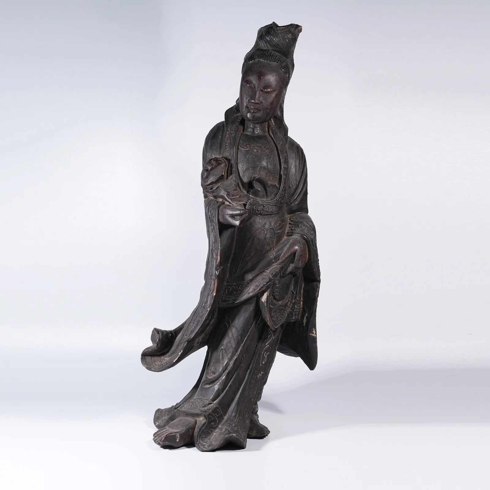 A ZITAN STANDING GUANYIN STATUE