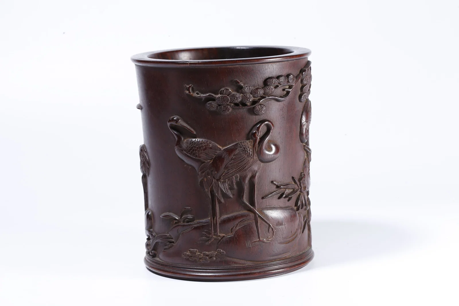A ZITAN WOOD BRUSH POT CARVED WITH PINE AND CRANE DECORATION