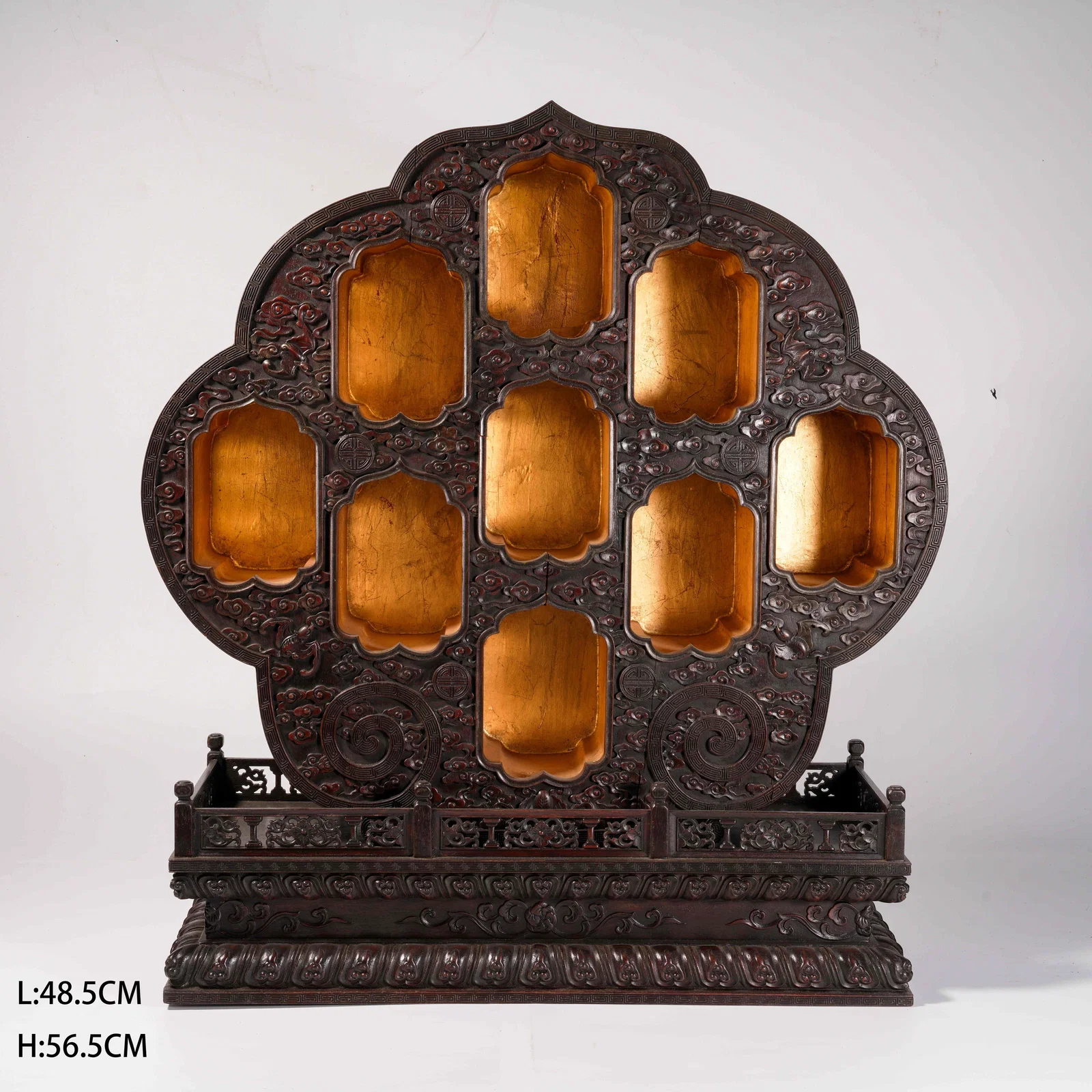 A ZITAN WOOD BUDDHIST SHRINE WITH GILDED LACQUER SUTRAS AND CLOUD-AND-DRAGON MOTIF