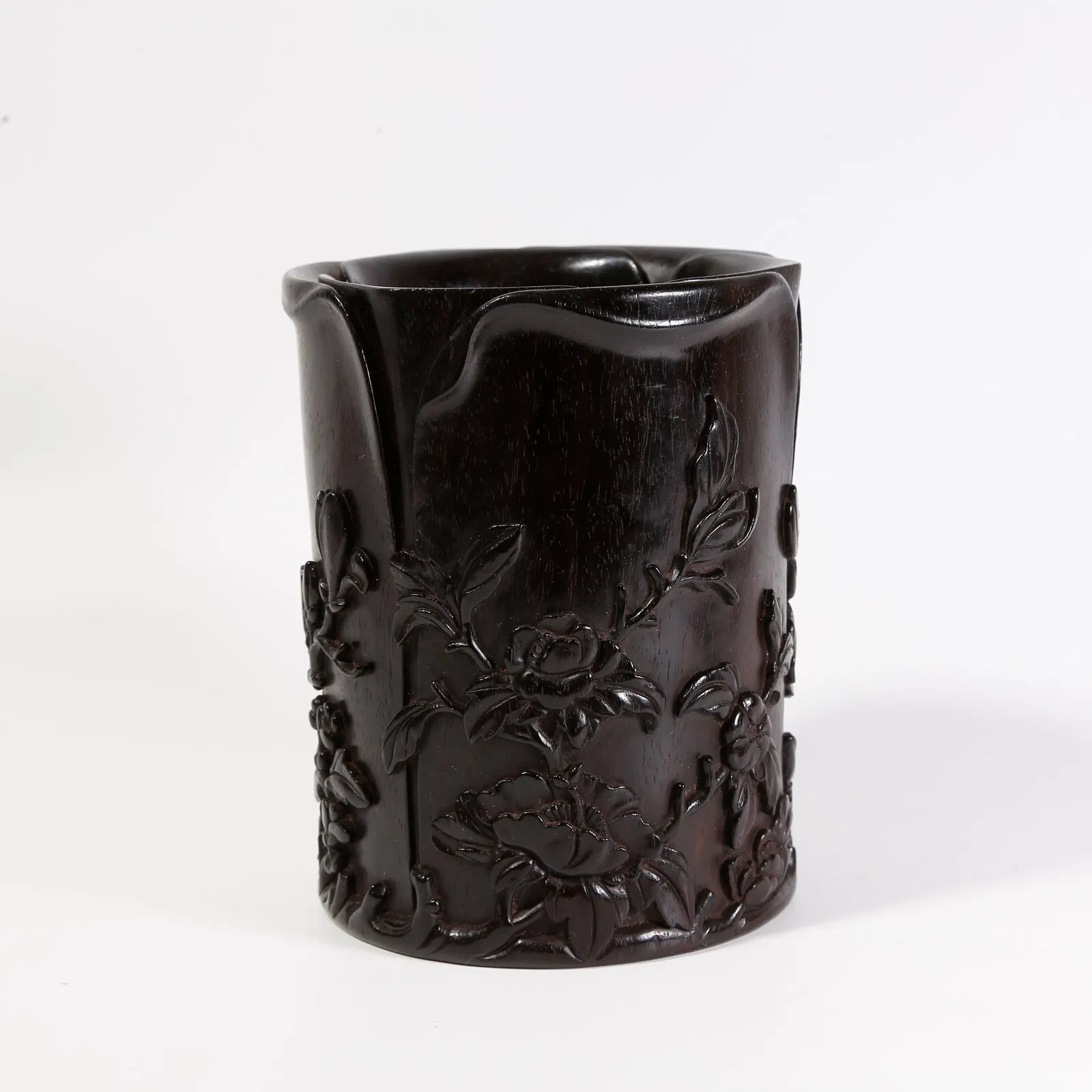 A ZITAN WOOD CARVED ARMREST WITH FLORAL MOTIF