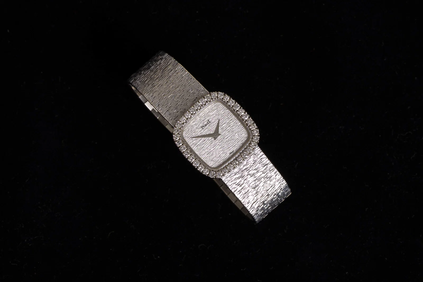 An 18 carat white gold and diamond set Piaget lady's cocktail watch, 20th C.