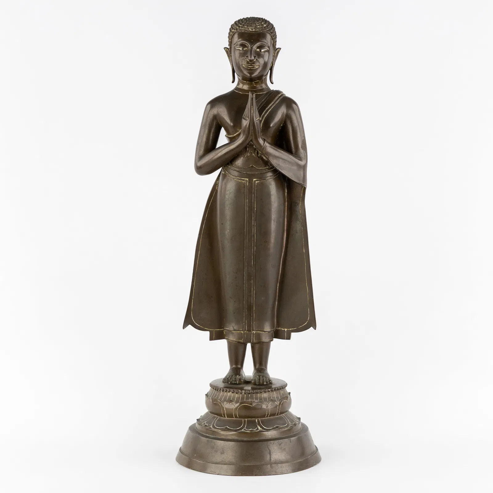 An antique standing Ayutthaya Buddhist Monk, patinated bronze, Thailand, 18th/19th C.