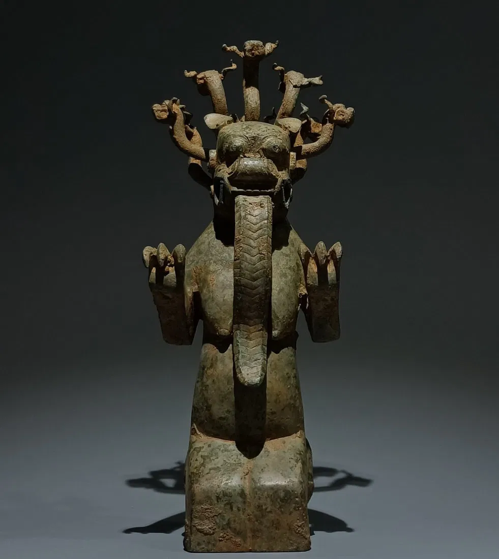 An Archaic Bronze Auspicious Beast Ornament
