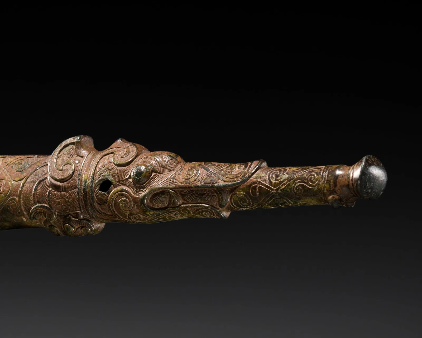AN ARCHAIC BRONZE 'DRAGON' FERRULE, ZUN, EASTERN ZHOU DYNASTY, SPRING AND AUTUMN PERIOD