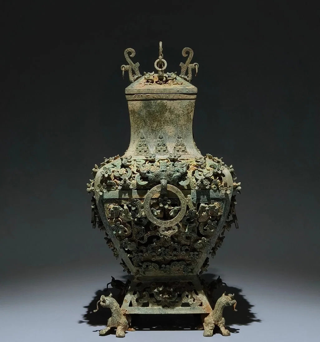 An Archaic Bronze Hollow Plum Blossom Pattern Beast-Ears Cover Pot