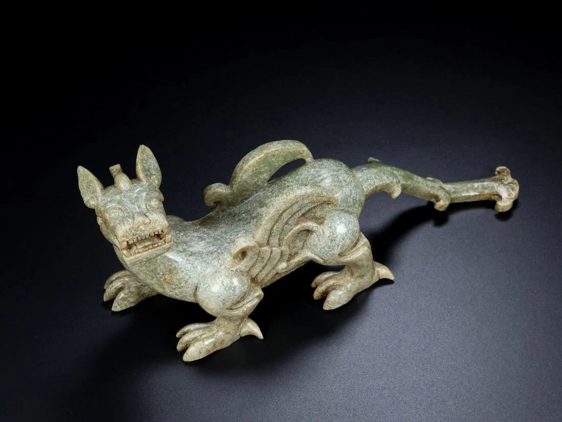 An Archaic Gaogu yu Auspicious Beast Ornament