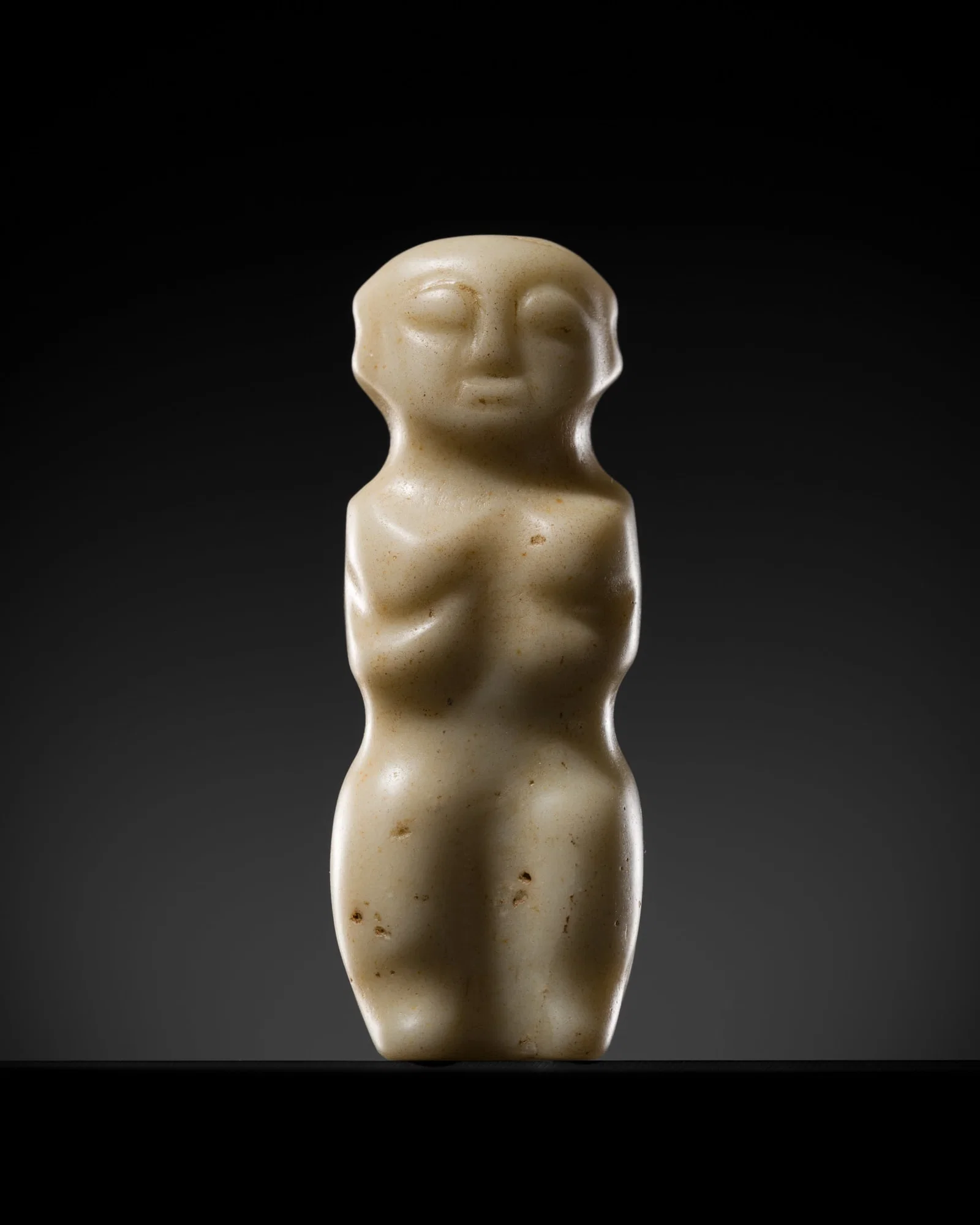AN ARCHAIC WHITE JADE 'HUMANOID' PENDANT, NEOLITHIC PERIOD, HONGSHAN CULTURE
