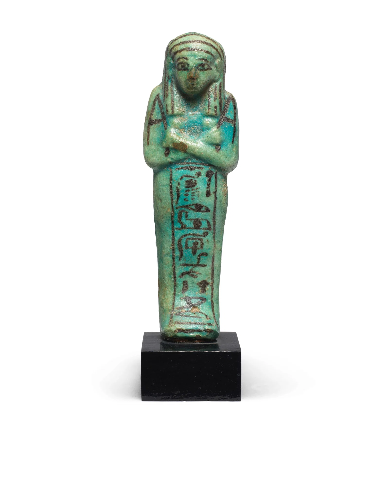 An Egyptian green glazed faience shabti for Pa-Her-Mer, Overseer of the Treasury