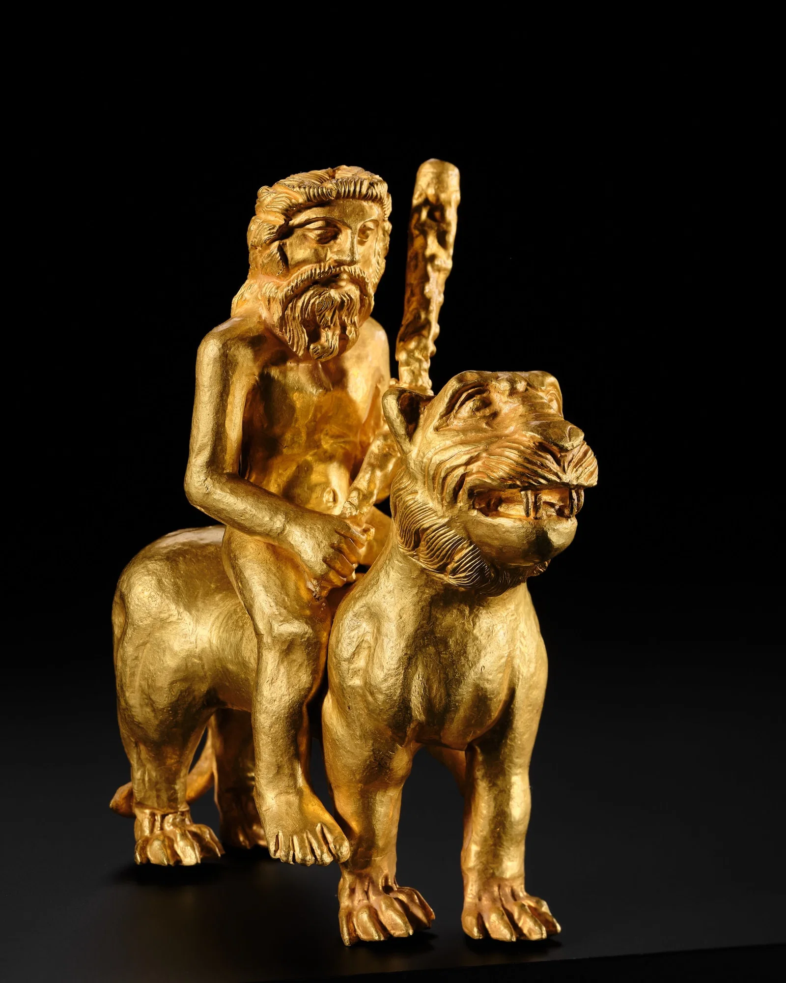 AN EXCEEDINGLY RARE GOLD FIGURE OF HERCULES RIDING A LION, CENTRAL ASIA, PROBABLY BACTRIAN, CIRCA
