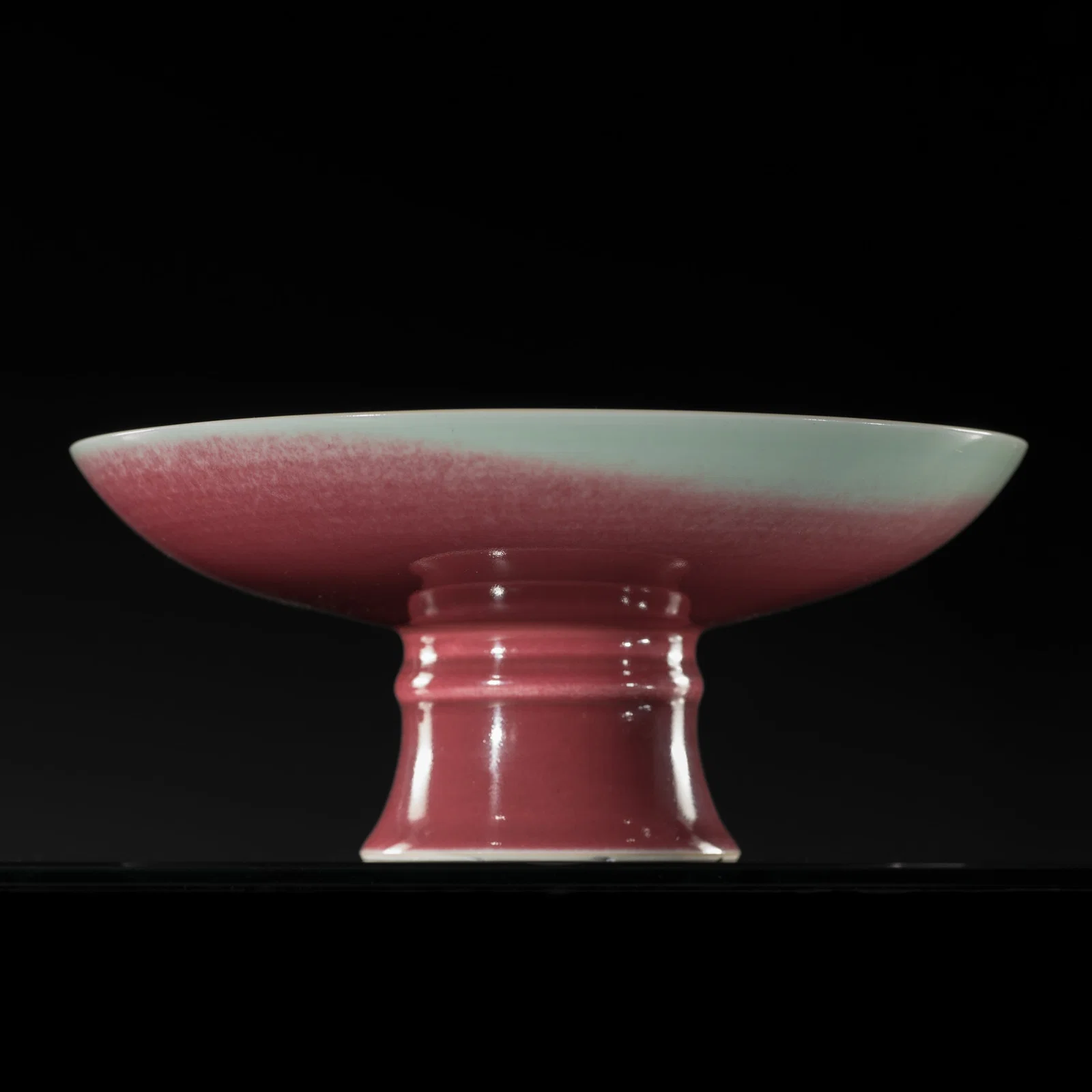 AN EXCEPTIONAL COPPER-RED GLAZED STEM CUP, QIANLONG MARK AND PERIOD