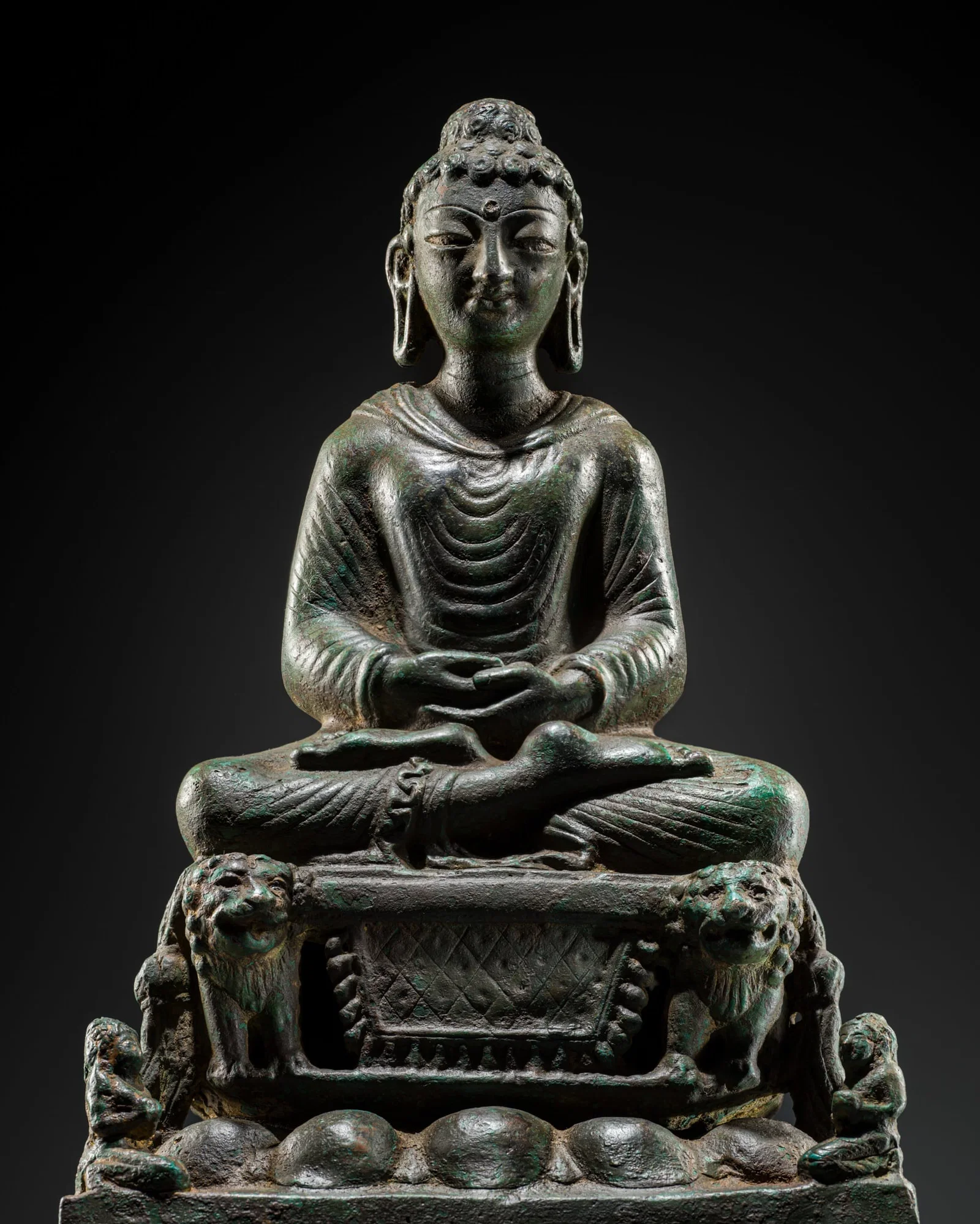 AN EXCEPTIONALLY LARGE BRONZE FIGURE OF BUDDHA ON THE LION THRONE, SWAT VALLEY, 7TH-8TH CENTURY, TL