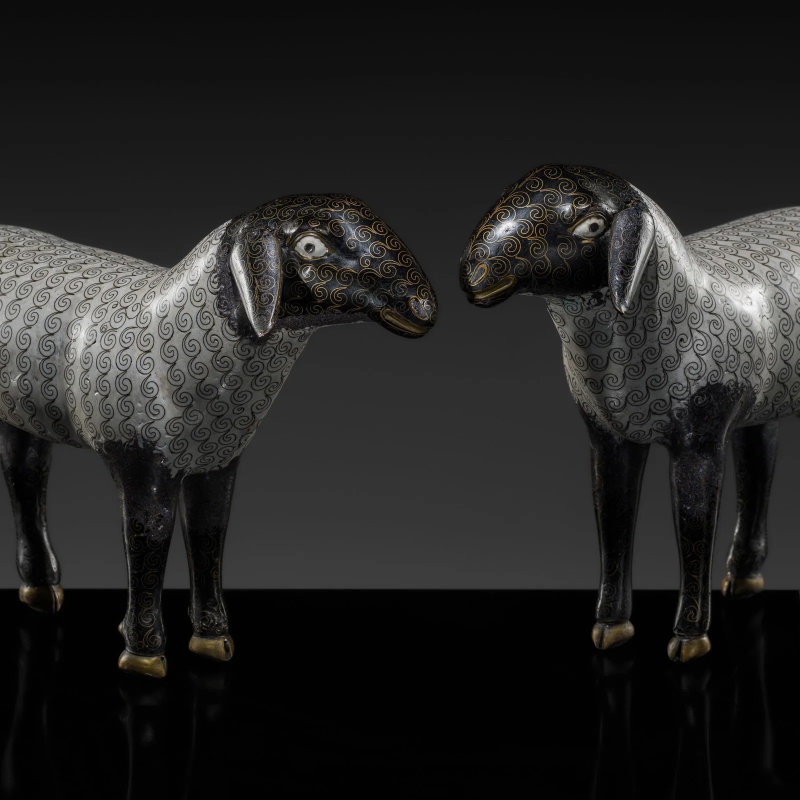 AN EXCEPTIONALLY RARE AND LARGE PAIR OF CLOISONNÉ ENAMEL 'SACRIFICIAL' SHEEP, QIANLONG TO
