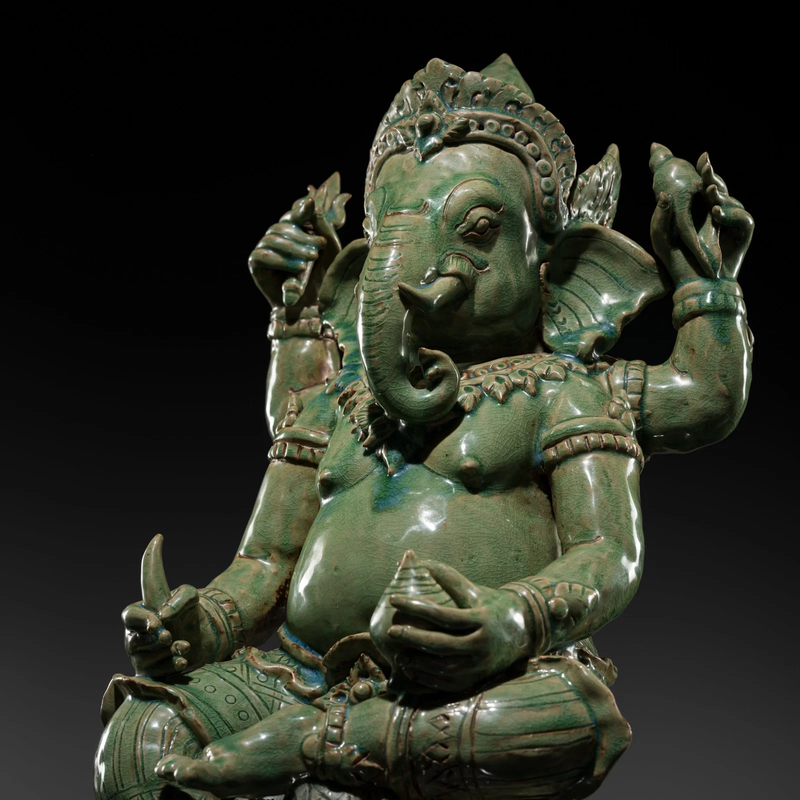 AN EXPRESSIVE CELADON-GLAZED FIGURE OF GANESHA, INDIA, 19TH TO FIRST HALF OF THE 20TH CENTURY