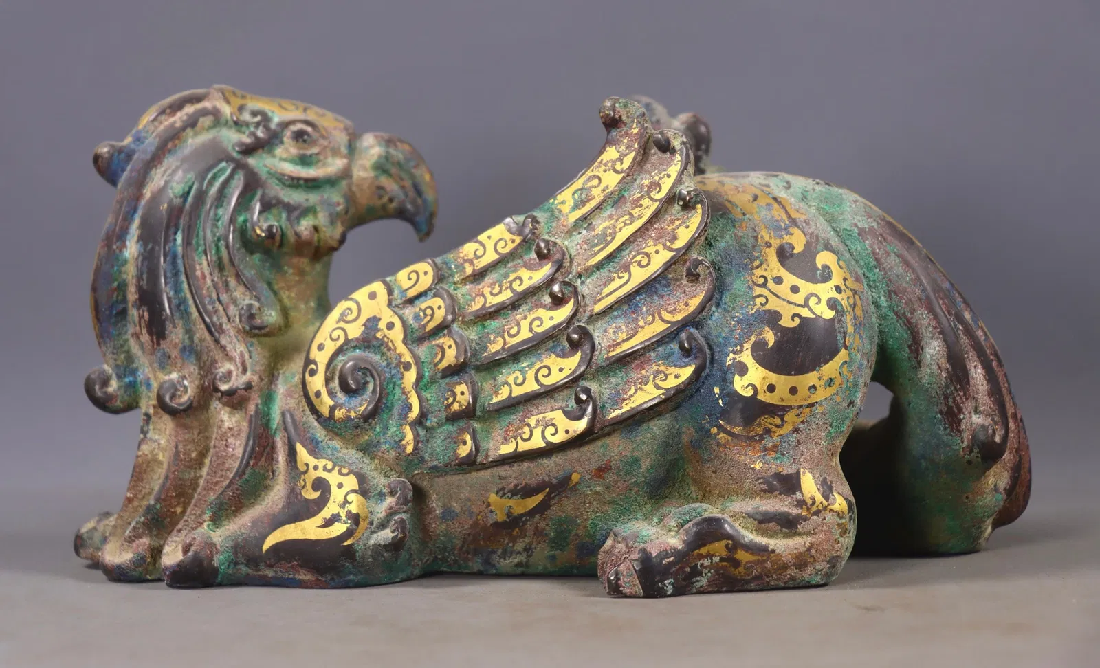 An Exquisite Bronze Inlaid Gold and Silver Auspicious Beast Ornament