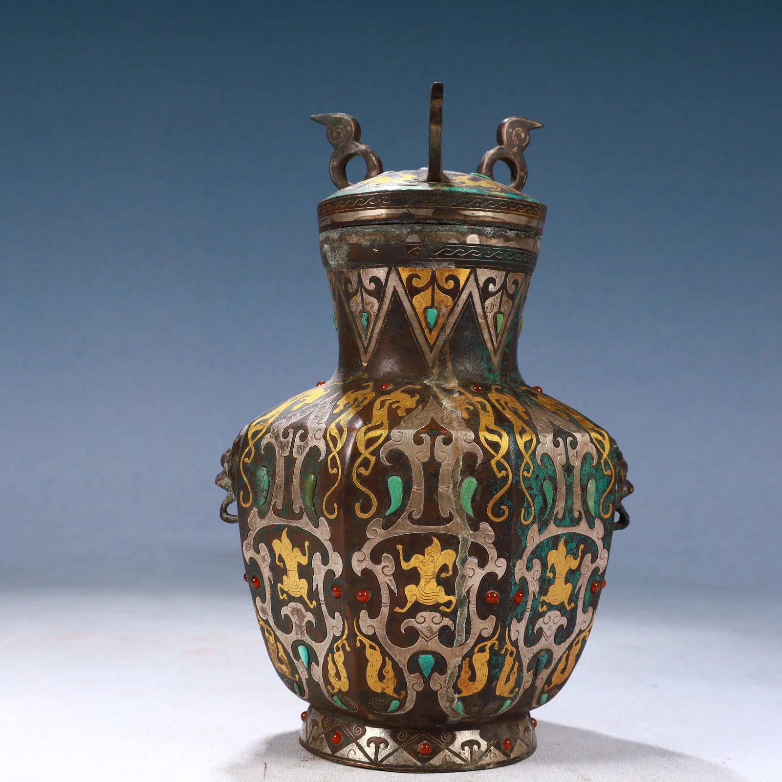 An Exquisite Bronze Inlaid Gold and Silver Auspicious Beast Pattern Beast-Ears Bottle