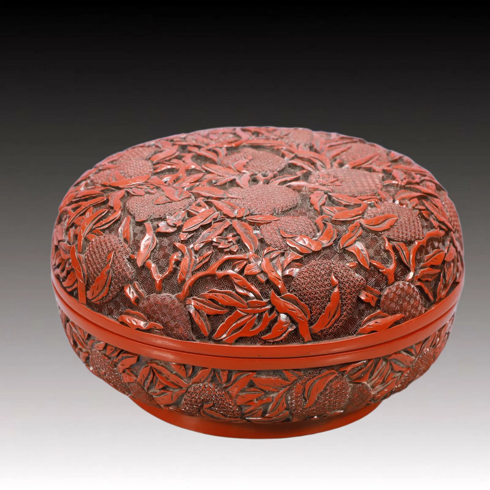 An Exquisite Carved Red Lacquer Peach Pattern Box
