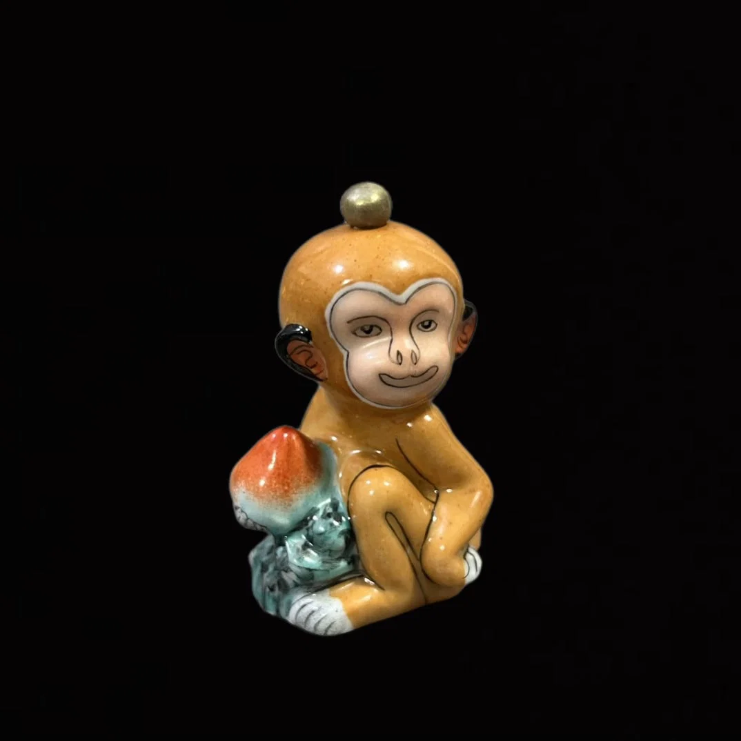 An Exquisite Famille-Rose Monkey Snuff Bottle
