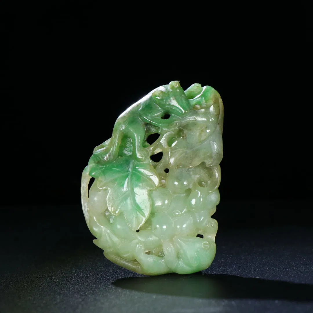 An Exquisite Jadeite Squirrel and Grapes Pendant