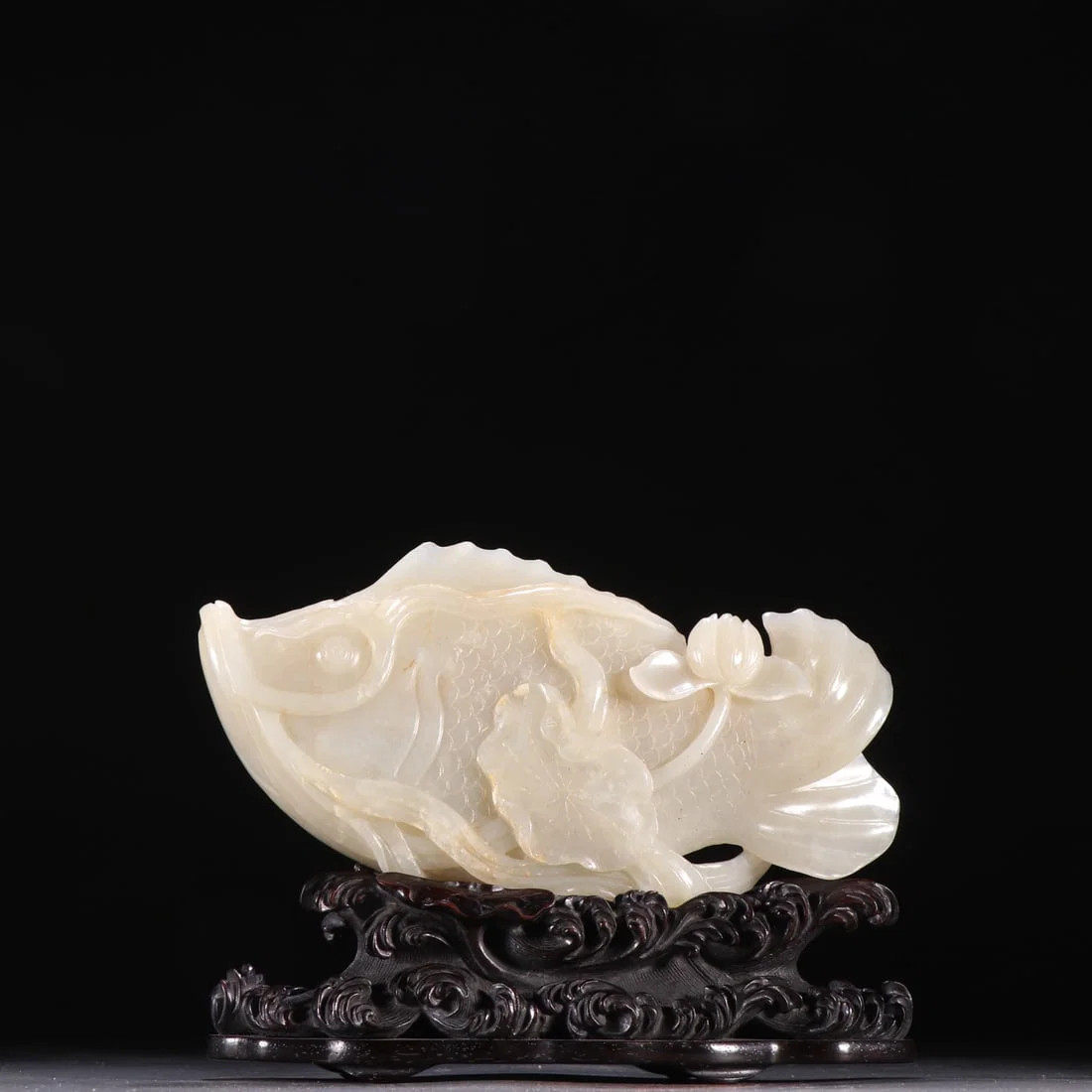 An Exquisite White Jade Fish-Shaped Ornament,With Zitanwood Base