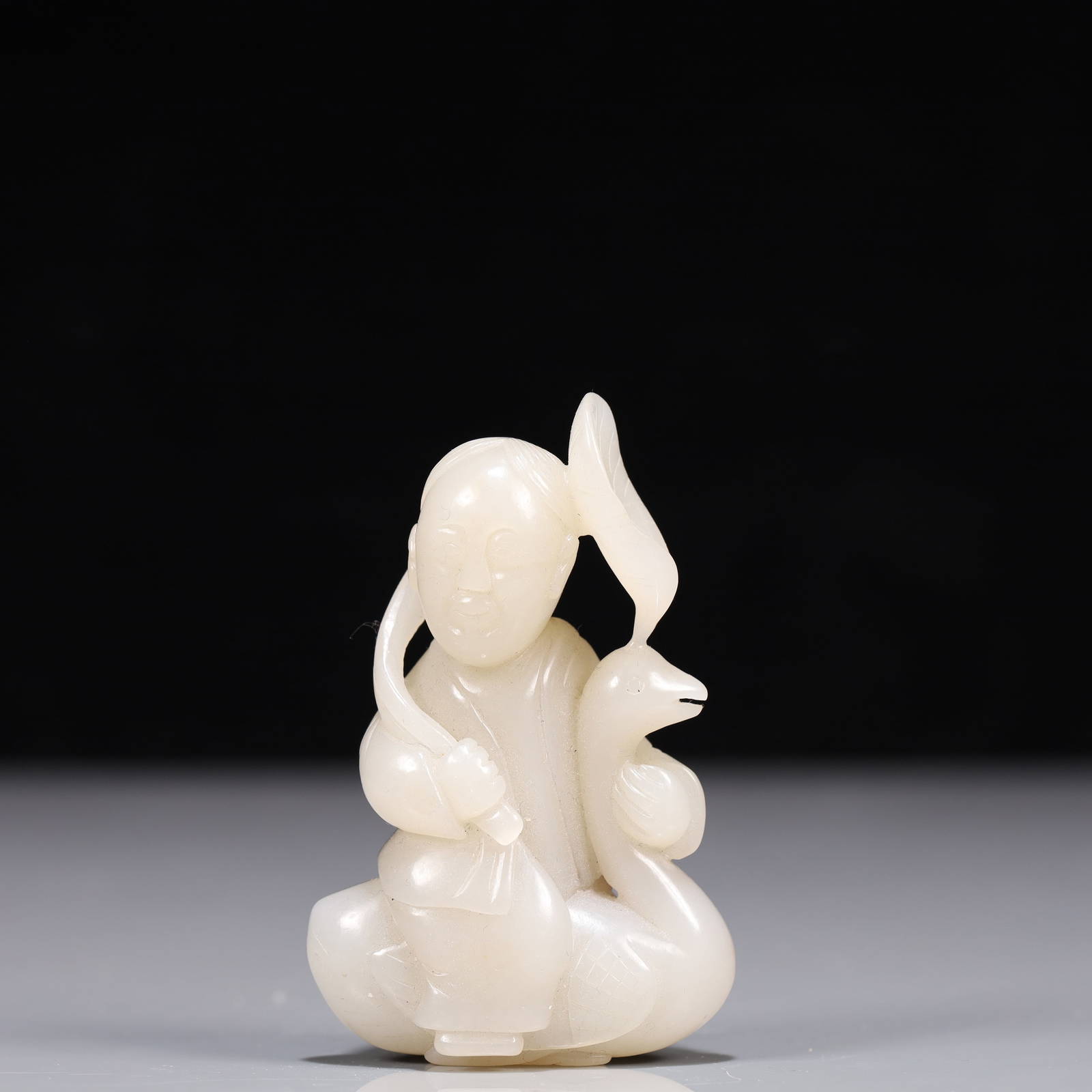 An Exquisite White Jade Goose and Figure Ornament