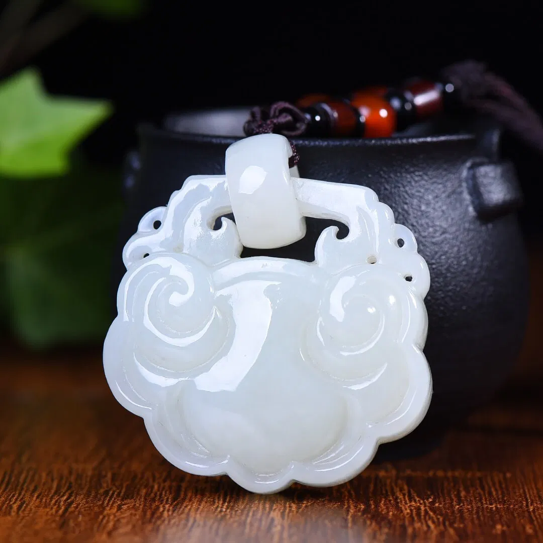 An Exquisite White Jade Lock-Shaped Pendant