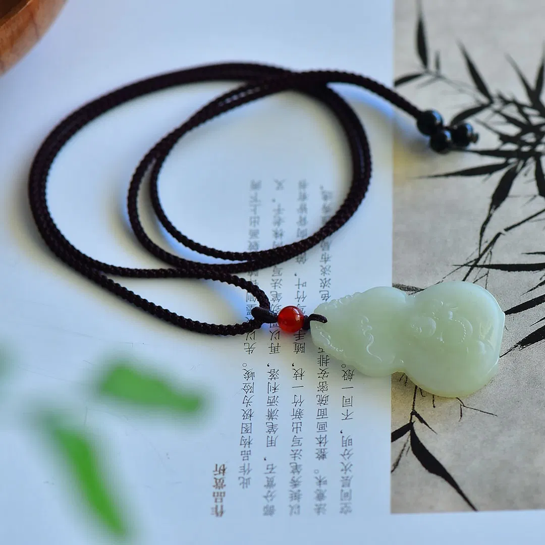 An Exquisite White Jade Maitreya Buddha Gourd-Shaped Pendant