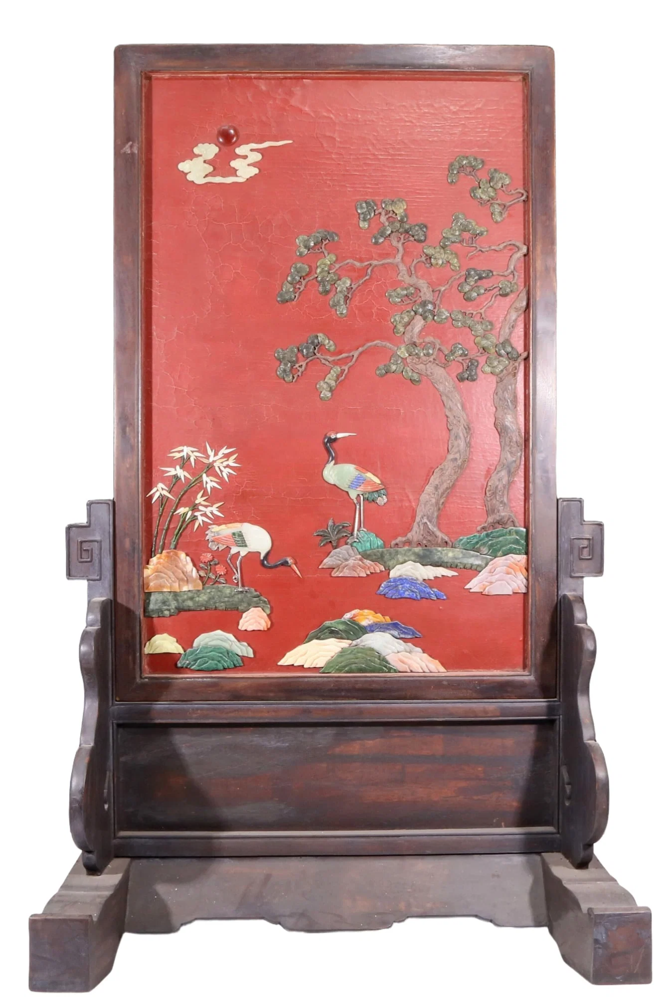 An exquisite zitanwood lacquered table screen with a pine and crane pattern inlaid with gemstones