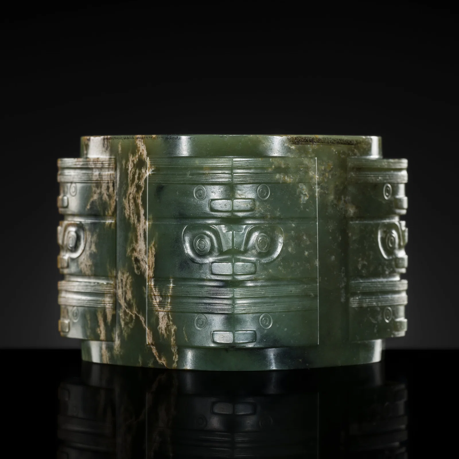 AN IMPORTANT AND EXTREMELY RARE GREEN JADE THREE-TIERED CONG, NEOLITHIC PERIOD, LIANGZHU CULTURE