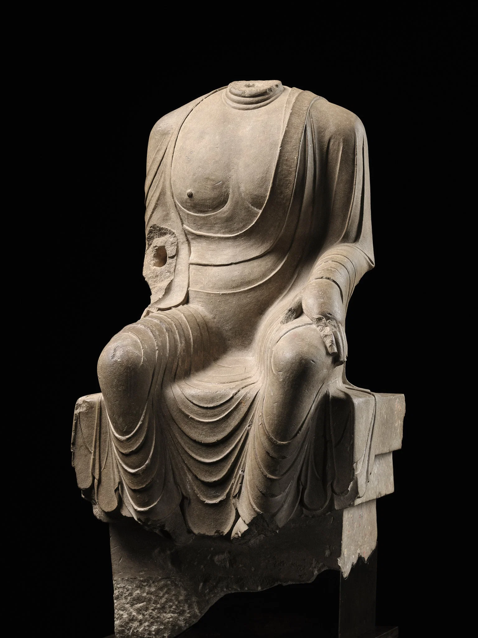 AN IMPORTANT AND RARE WHITE MARBLE TORSO OF BUDDHA MAITREYA, TANG DYNASTY, CIRCA 690-700 AD