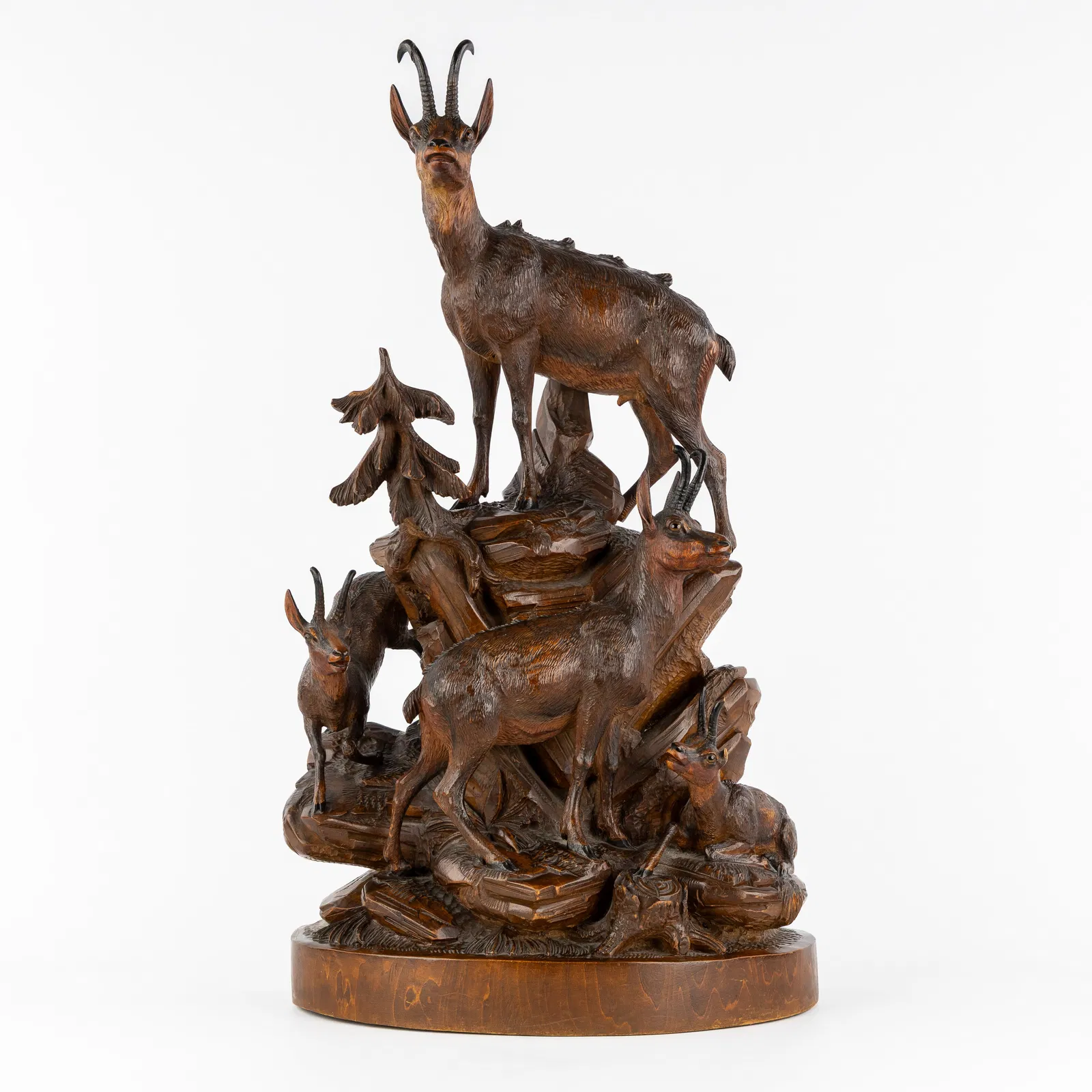 An Impressive wooden hunting sculpture, Chamois on a Rock, Black Forest, circa 1900.