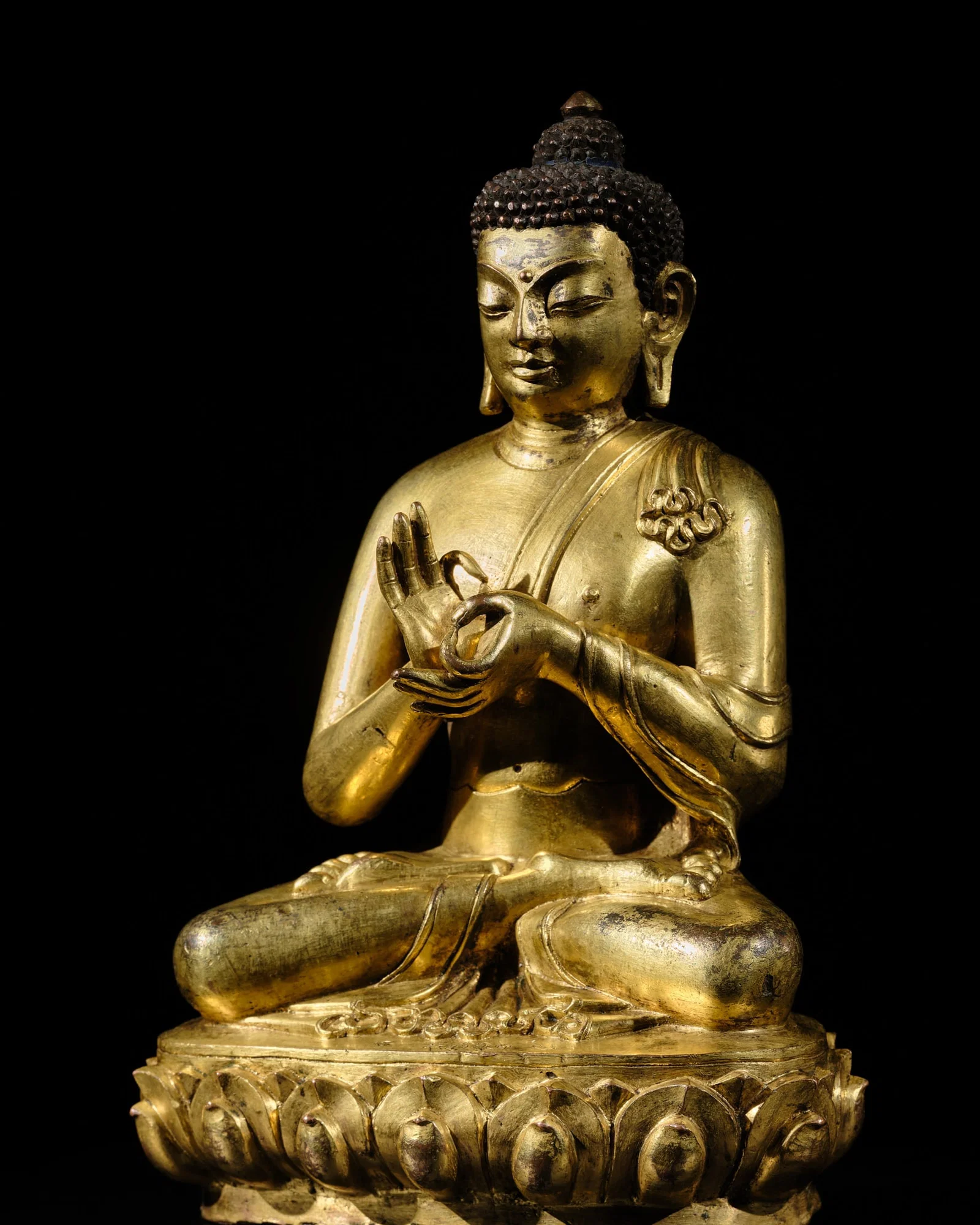 AN INSCRIBED 'MOST EXCELLENT GEM' GILT-BRONZE FIGURE OF BUDDHA DIPANKARA, TIBET, CIRCA 16TH CENTURY,