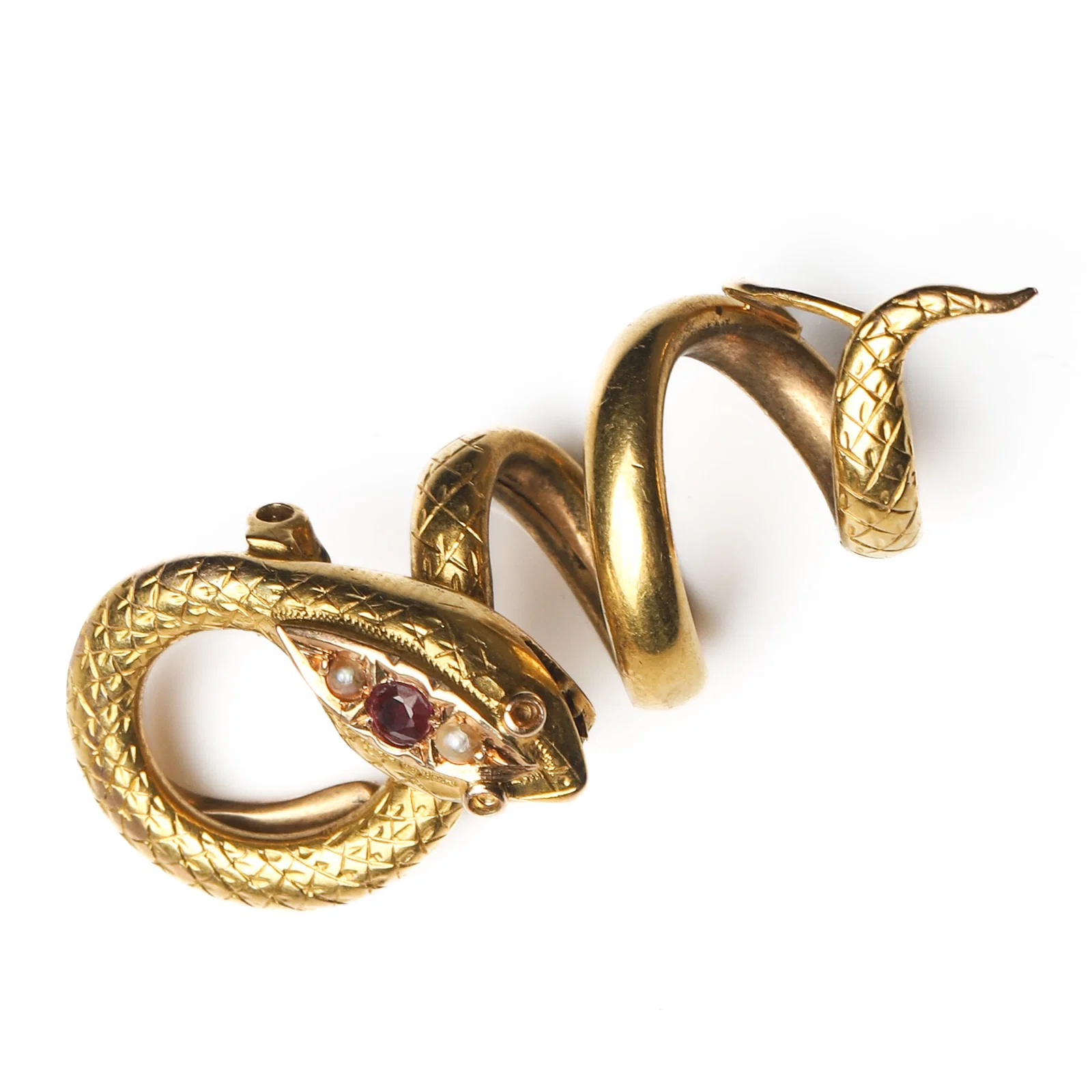 ART NOUVEAU PERIOD (1880–1920), A FRENCH GOLD COILED SERPENT CHAIN CLIP WITH RUBY AND PEARL