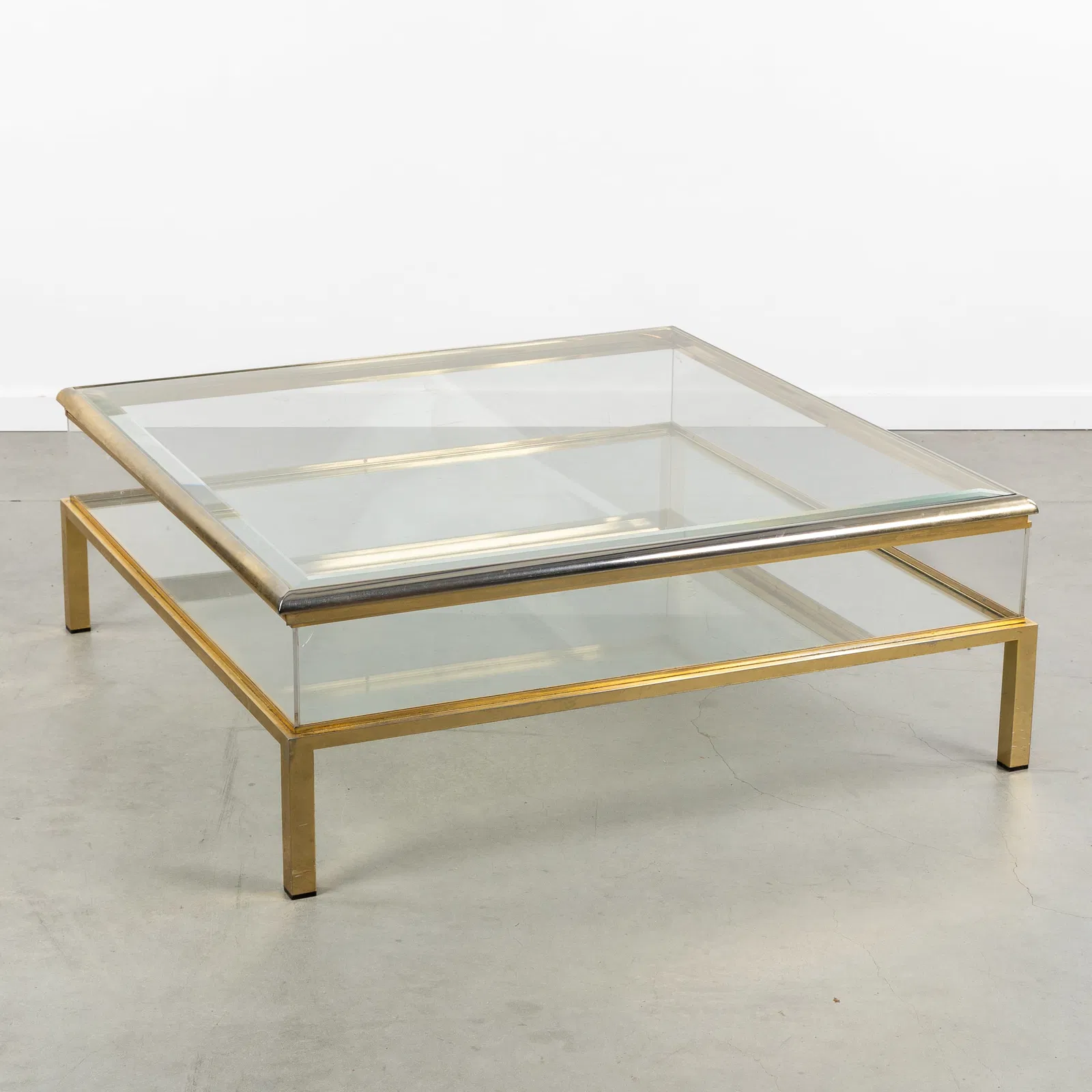 Belgo Chrom, A Large display coffee table. Gilded metal and glass. Circa 1970.