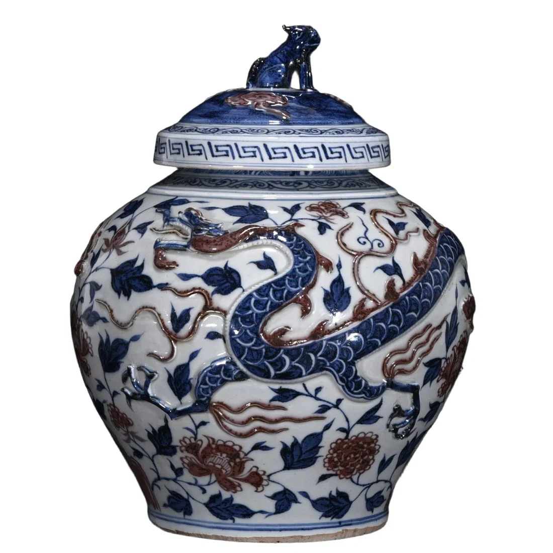 Blue and white glazed jar with red dragon motif on the lid