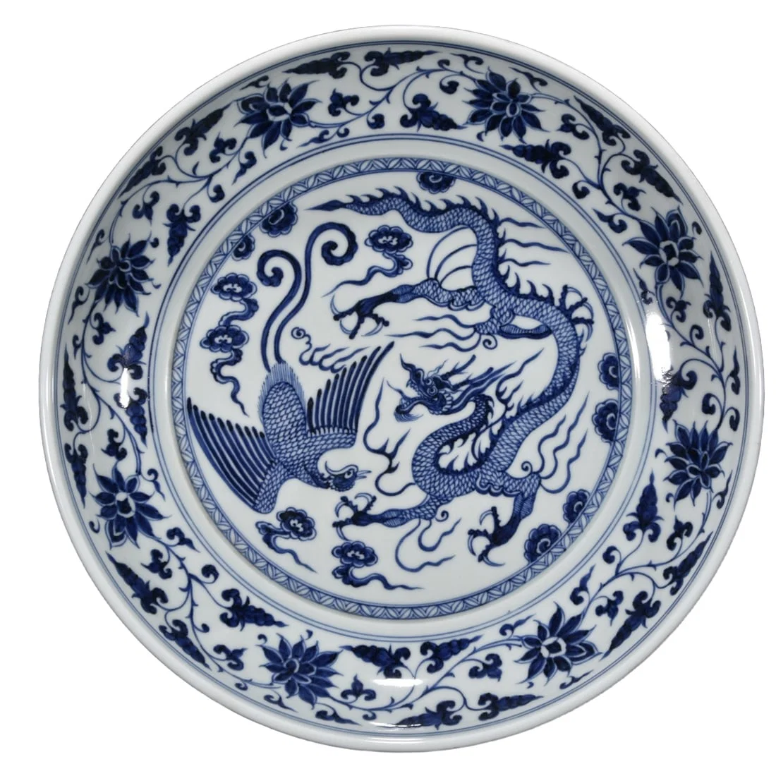 Blue and white porcelain plate with dragon and phoenix design.