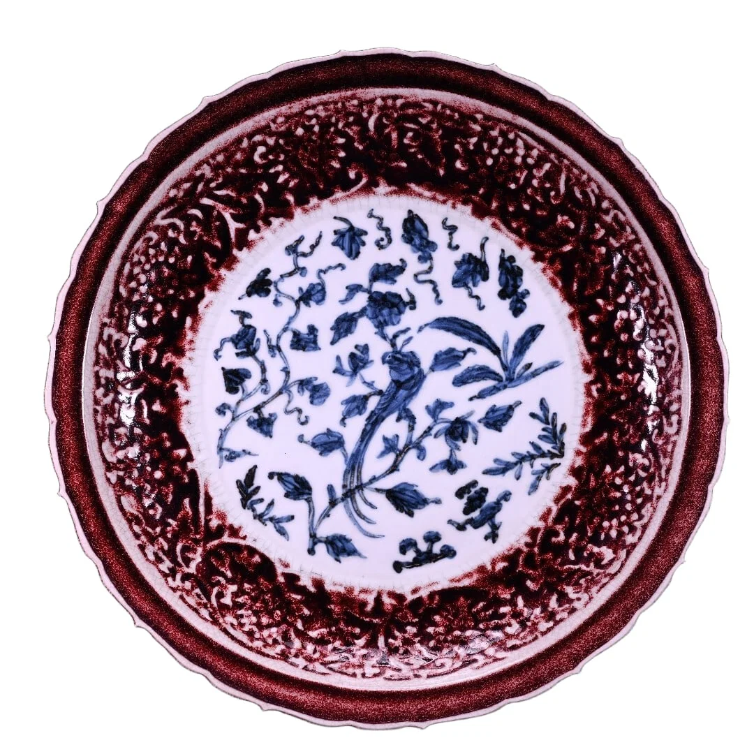 Blue and white porcelain plate with underglaze painted floral design