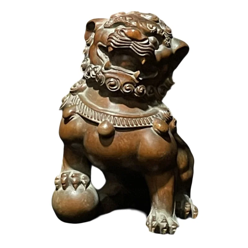 Carved boxwood sculpture of a howling monkey.